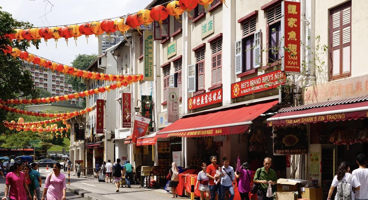 Smith Street, Chinatown, Singapore: the conservation shophouse street opposite Chinatown Complex where 42, 44 and 46 Smith Street stand. Street photo via Property News Asia; agent photo of the three buildings to follow from ERA.