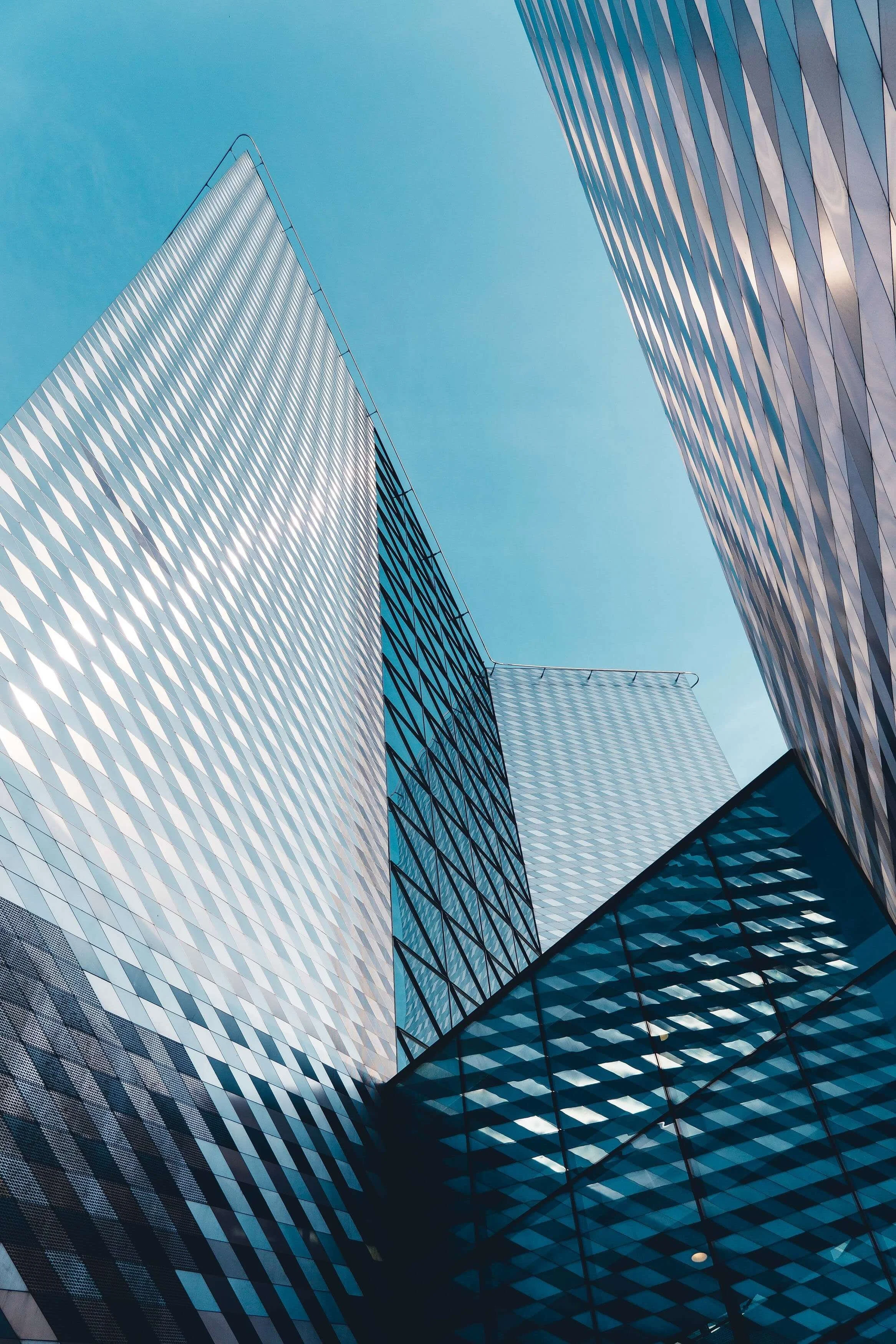 Glass office tower representing cross-border deal sourcing